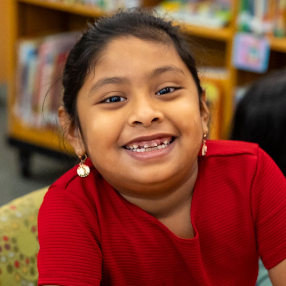  An elementary student grins for the camera